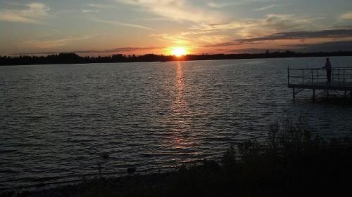 Sun low in the sky by the dock 